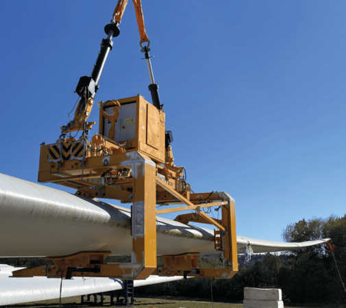 2507-AIR-pala-vertical-min Wind turbine blade lifting tool attached to crane during onshore installation