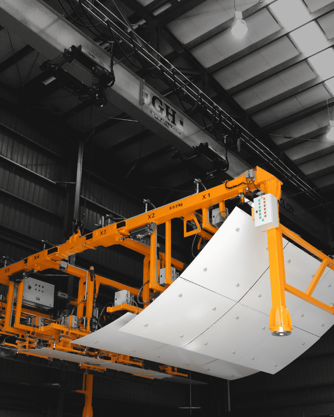 Crosby Airpes custom lifting beam for precise handling of oversized panels in industrial environments.