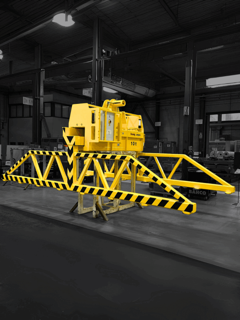 Custom 10T heavy duty sheet metal tong by Crosby Airpes in industrial setting, designed for lifting large sheet metal packages safely.